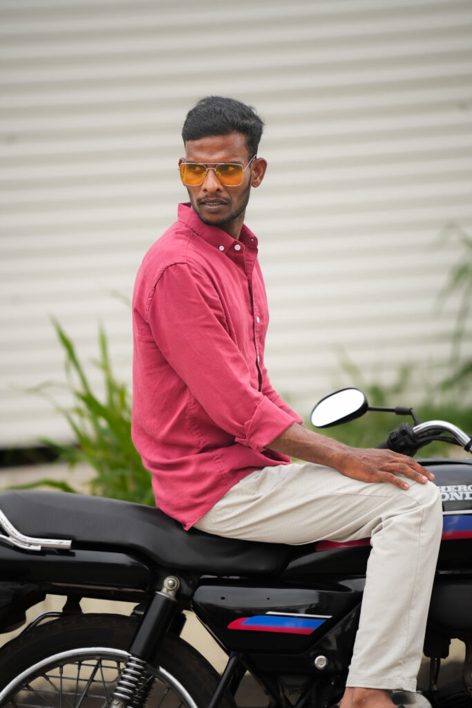 Bike photoshoot in Kochi featuring a man posing with his Hero Splendor motorcycle