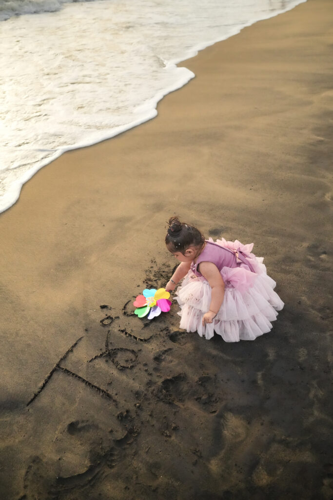 Kids beach photoshoot in Kochi featuring a 1.6-year-old baby girl during a Kerala family vacation