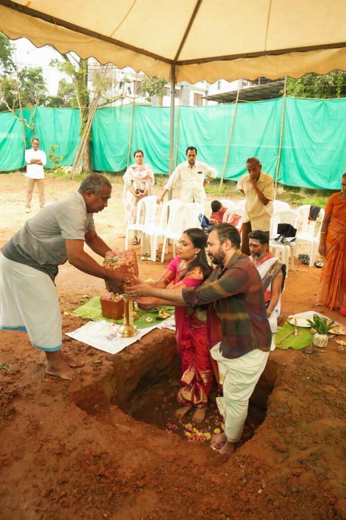 Traditional Kallidal ceremony photography in Kochi with sacred pooja and first stone laying rituals.