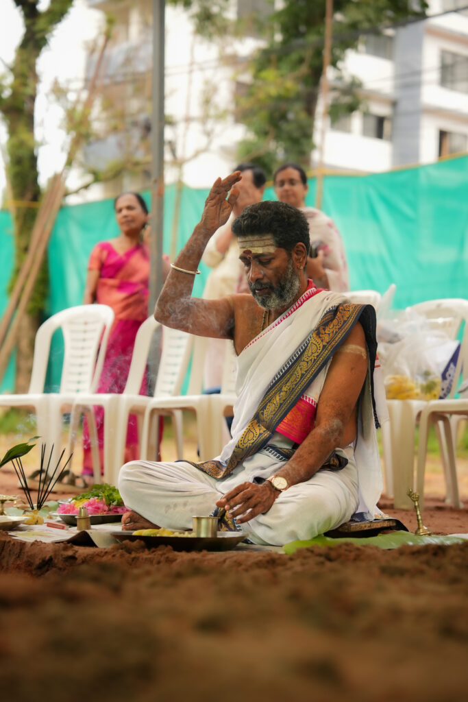 Traditional Kallidal ceremony photography in Kochi with sacred pooja and first stone laying rituals.