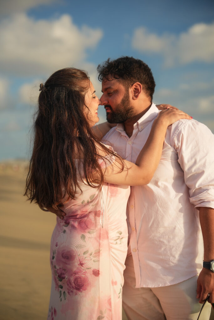 Beach photoshoot in Kochi featuring a married couple with romantic candid portraits