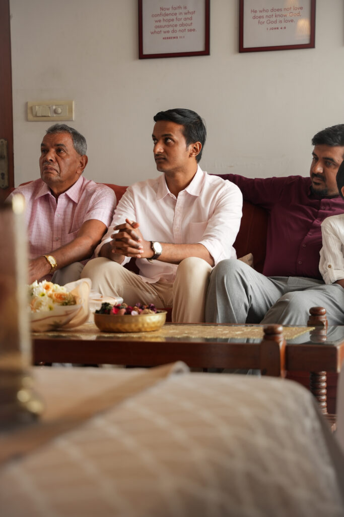 Candid Pennukaanal photography in Kochi capturing a bride-to-be with family during a traditional Kerala marriage meeting